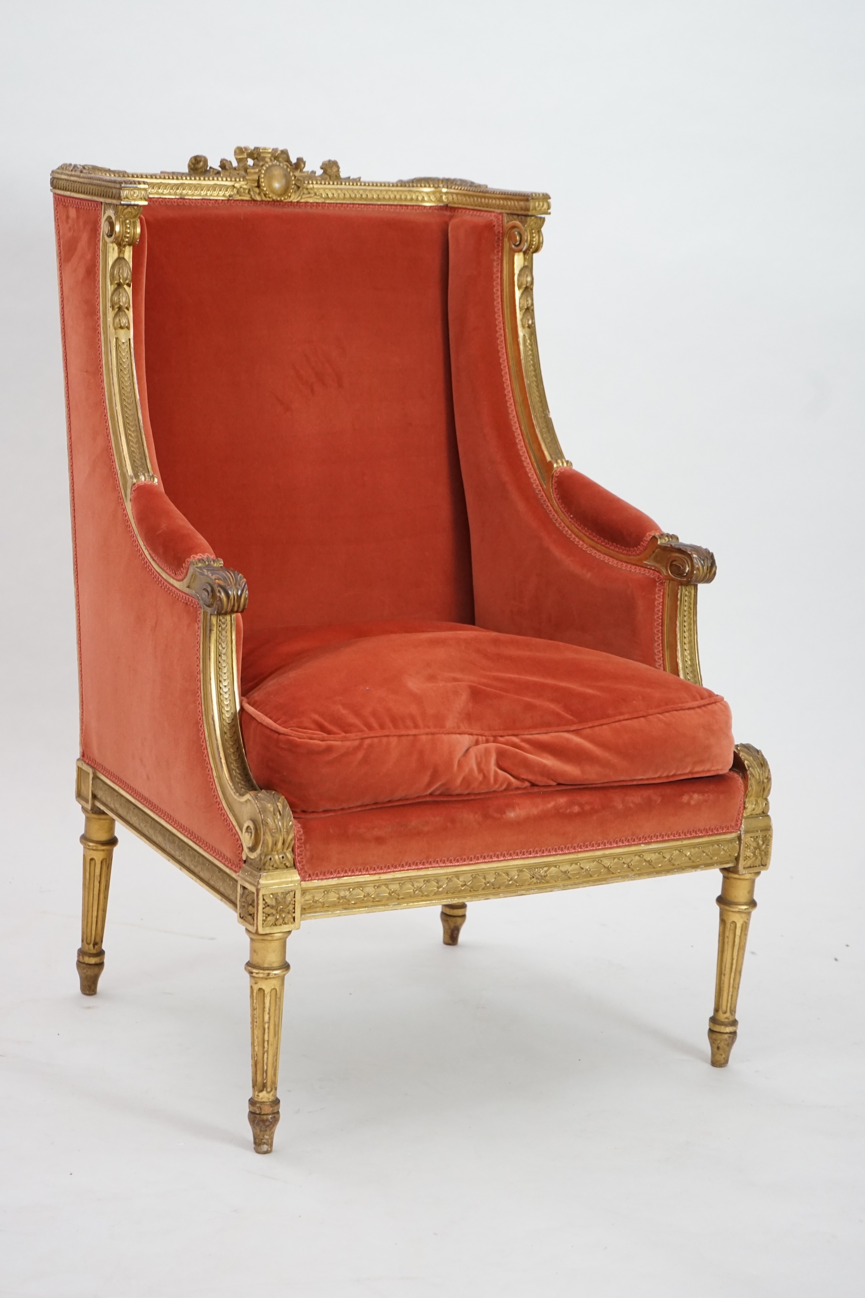 A Louis XVI style carved giltwood fauteuil, circa 1900